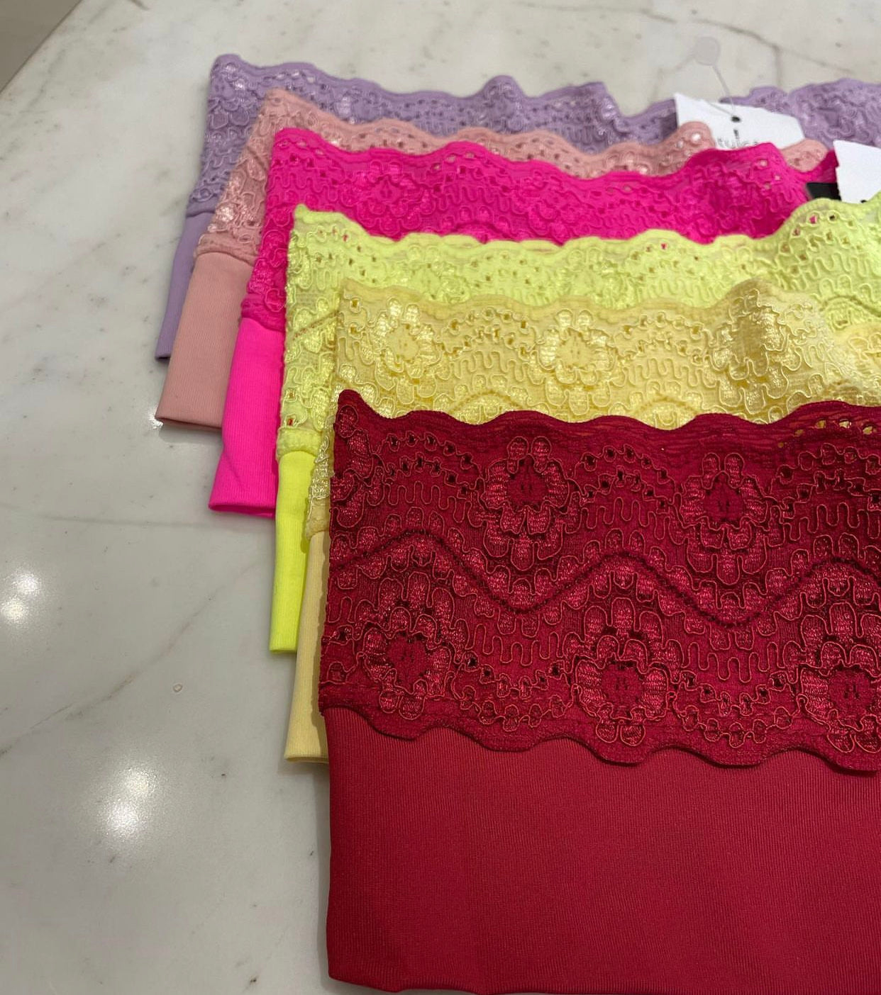 Floral lace trim and appear to be made from a soft.