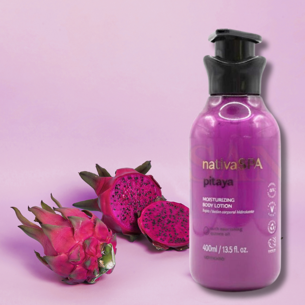 Purple bottle of nativaSPA pitaya body lotion with dragon fruits on a pink background