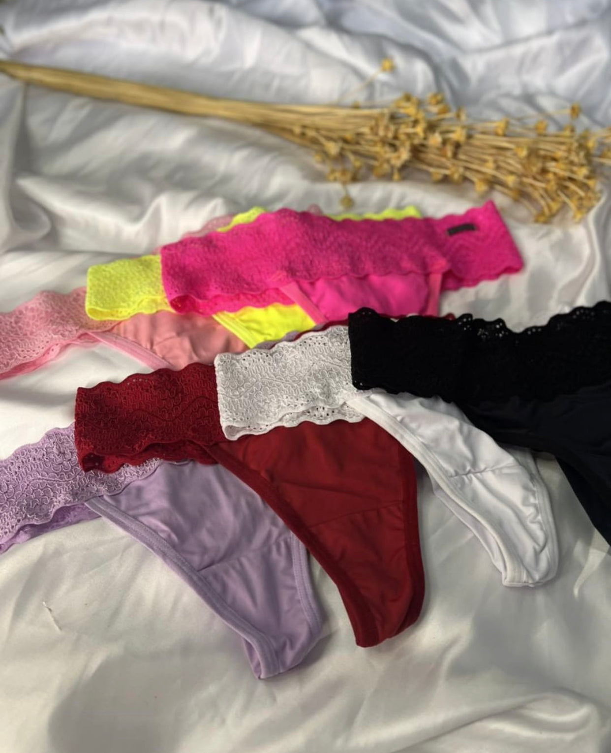 Set of women's multi-colored lace  thongs. 