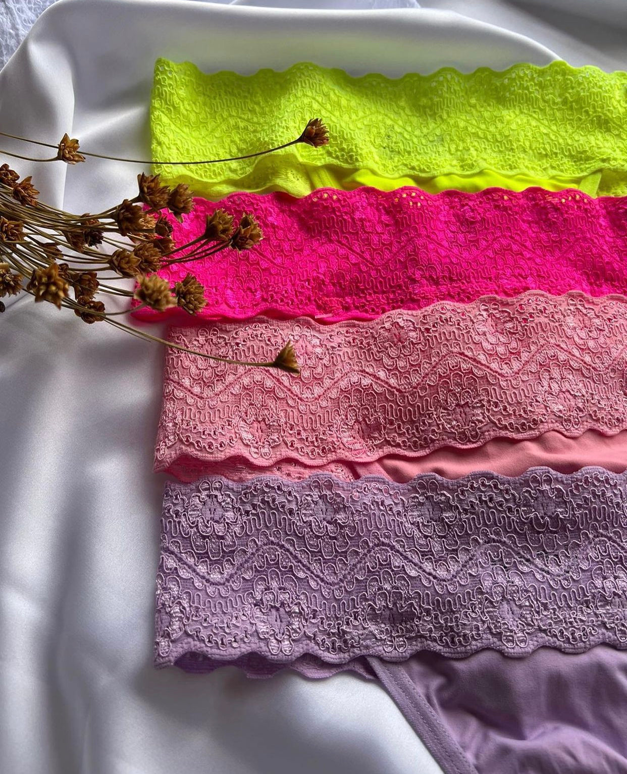 Feature a wide lace waistband and a minimal coverage thong back.